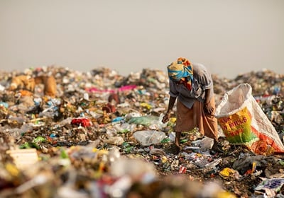 garbage collected picking plastic trash from a hazardous dumpsite in kenya