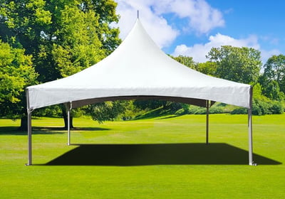 A white canopy tent on top of grass