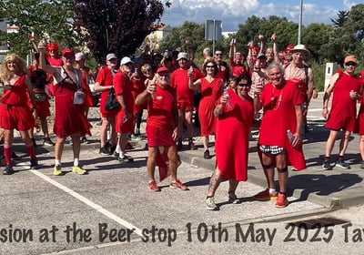 people gathered for a red dress run