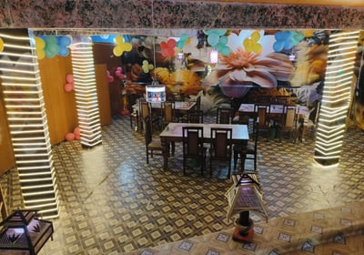 a restaurant with a large sitting space - sarpanch Restaurant