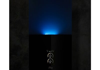 a blue light shining on a black background