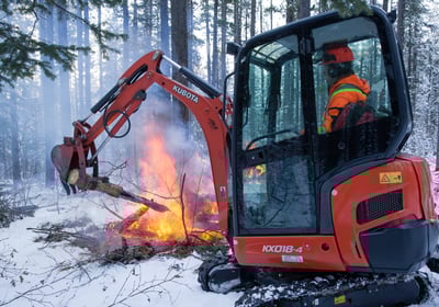 Using mini excavator to burn firesmart treatment debris in kananaskis AB