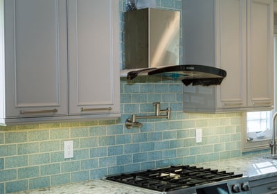 a kitchen remodelwith a new  stove top and a stove top