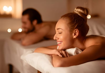 a man and woman in a spa treatment room