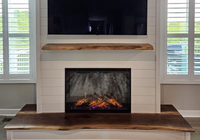 Custom live-edge wood fireplace mantel and hearth with electric fireplace – modern shiplap wall