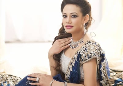 a woman in a blue dress and jewelry | Fashion & Lifestyle Exhibition | THE KABIR COMPANY