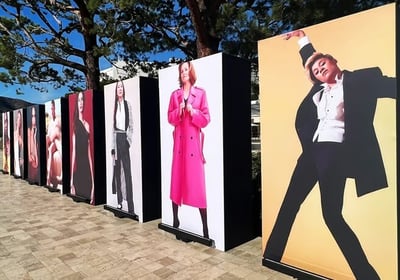 a row of posters with a man in a tuxedo | CORPORATE EVENT | The Kabir Company