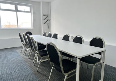 meeting room table with chairs in meeting room at DBC