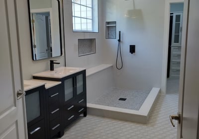 a bathroom with a shower and a shower
