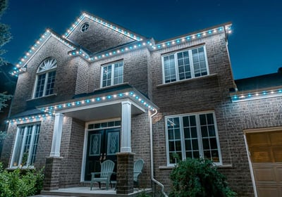 Celebright LED roofline lighting glowing in multiple colours on a GTA house