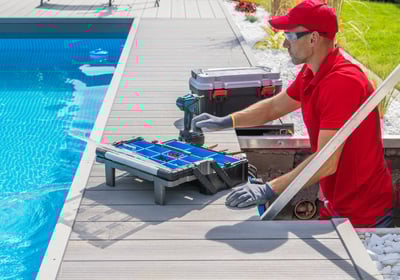 a man in a red shirt is using a pool