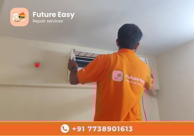 Future Easy technician repairing an indoor AC unit