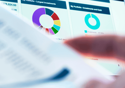 Close-up of portfolio insights with a colorful pie chart and investment details on a laptop screen.