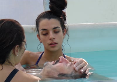 a man and woman in a swimming pool, rebirth and Repair, watsu