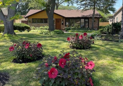 Andy Albright's garden planning example with a house in the background and his flower arrangements