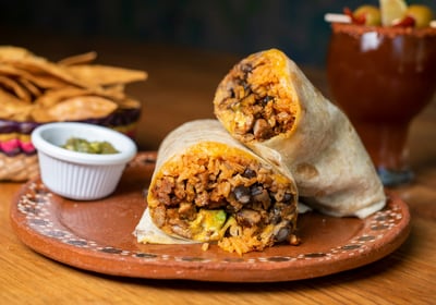 a burrito with a burrito and chips, Street Local at Tacos Mixes Los Angeles