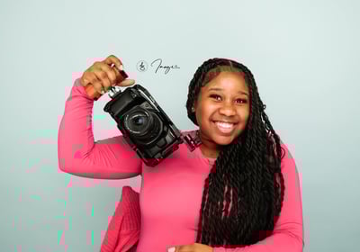 A Female Holding a camera