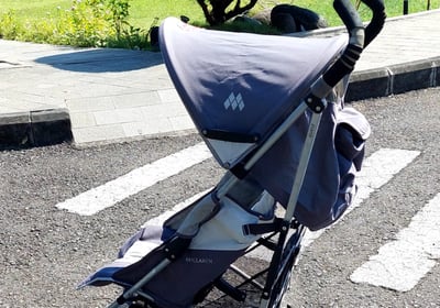 a stroller with a baby in a stroller
