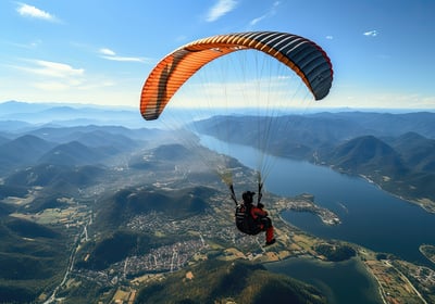Man paragliding in the blue sky