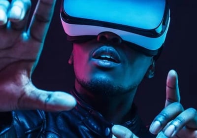 a man in a leather jacket and glasses with a virtual reality