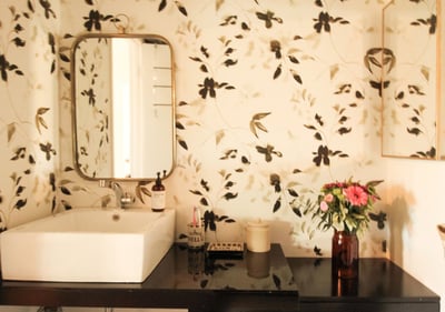 bathroom remodel with floral wallpaper and modern sink basin