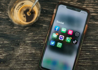 iPhone and Cold Drink on Desk