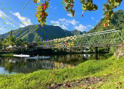 View of the bridge leading to Teahupoo with the 2024 Olympic Games logo displayed, Tahiti, French Polynesia.
