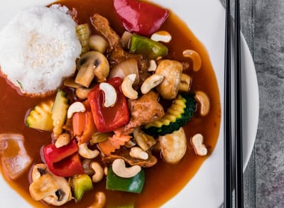 a plate of food with chopsticks