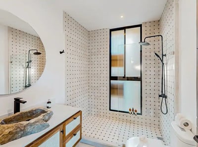 a bathroom with a sink and a large mirror