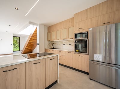 a kitchen with a stainless steel refrigerator and a stainless steel refrigerator