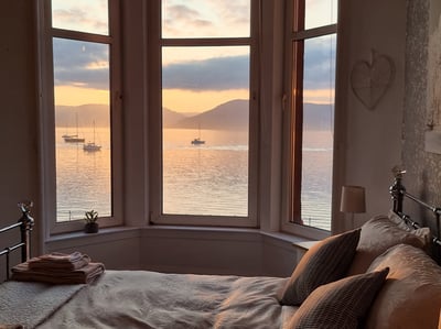 The bedroom at Gourock Seaview Holiday Let with a view of the ocean and boats
