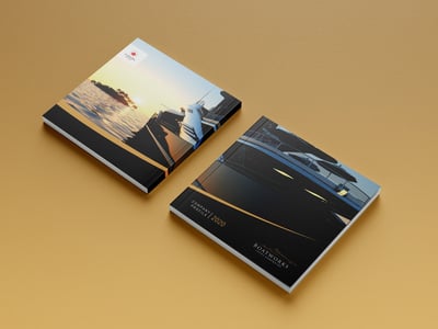 a book with a boat and a magazine cover