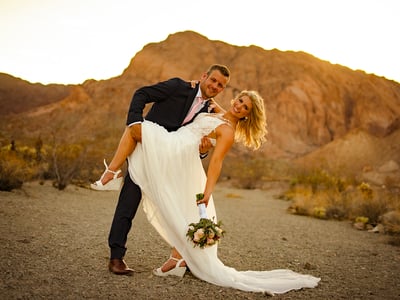 a man and woman are posing for a picture