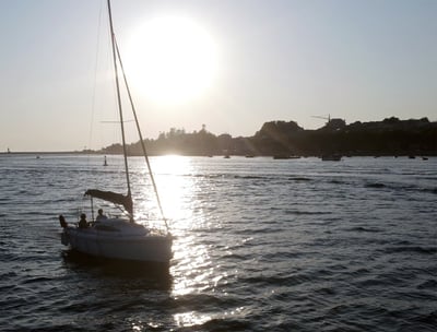 The sailboat Monark sailing on the Douro River at sunset