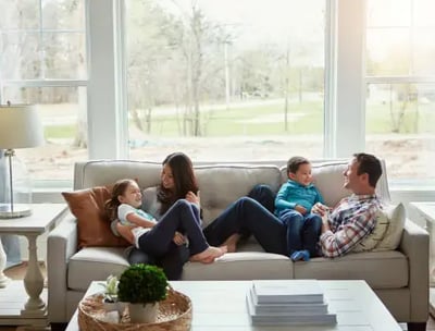 Family is relaxing comfortably because their electric and HVAC systems are safe, and keeping them comfortable.