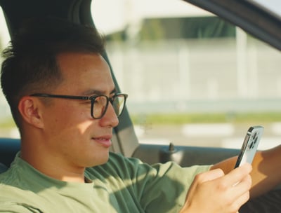 a man in holding a cell phone