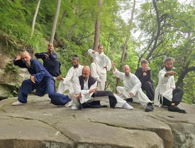In the heart of nature, a Wudang family moves in harmony, weaving Tai Ji and Bagua into life.