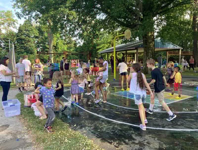 Children in a water balloon fight at Crescent Hills Park