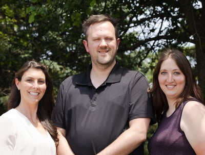 3 therapists looking toward the camera