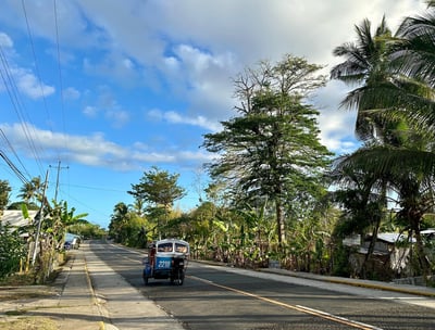 Siquijor island road with tricycle or tuktuk driving 