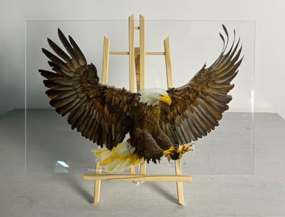 an eagle printed on glass with a wall printer