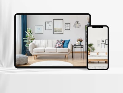 A tablet and smartphone displaying a virtually staged living room with modern furniture and decor