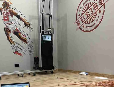 a wall printer printing branding and logos