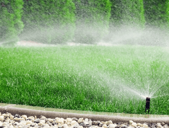 a sprinkler sprinkler sprinkles in the grass