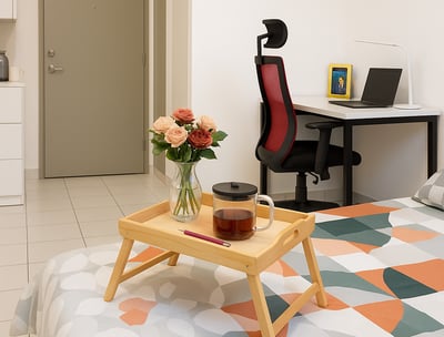 a bed with a tray with a tray with a tray of flowers