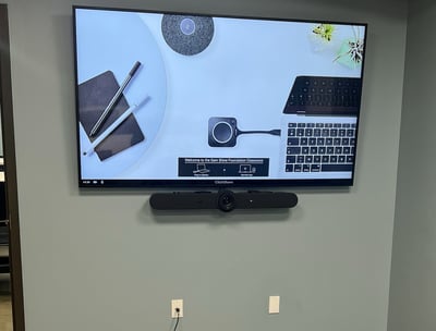 Image of a display with a Logitech Rally Bar