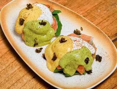 a plate of salmon egg benedict