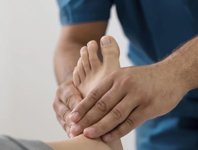 a man is shown with a foot massager