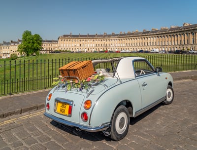 Nissan Figaro car with picnic basket