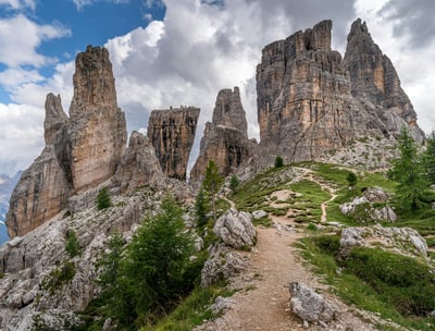 a trail leading to a mountain with a trail leading up to the top of a